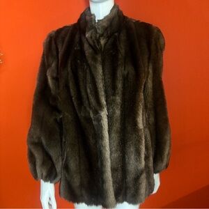 Luxurious 1940s brown faux fur coat with a touch of elegance fashion vintage